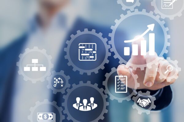 This image shows a project manager presenting management skills with graphic interface displaying icons of planning schedule of tasks and deliverables, budget, team work, scope, risks, strategy, with gears