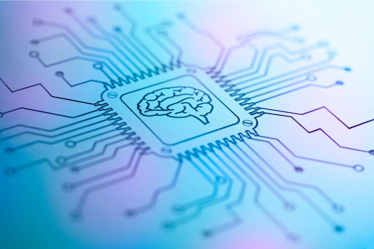 Graphic of white and blue computer chip with a brain at the centre.