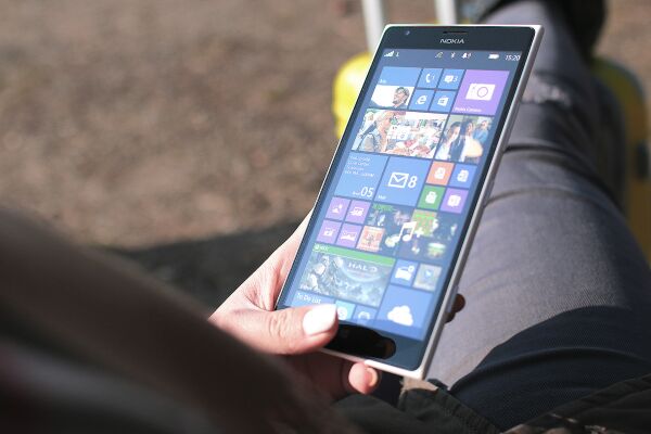 Nokia smartphone displaying Windows Phone home screen.