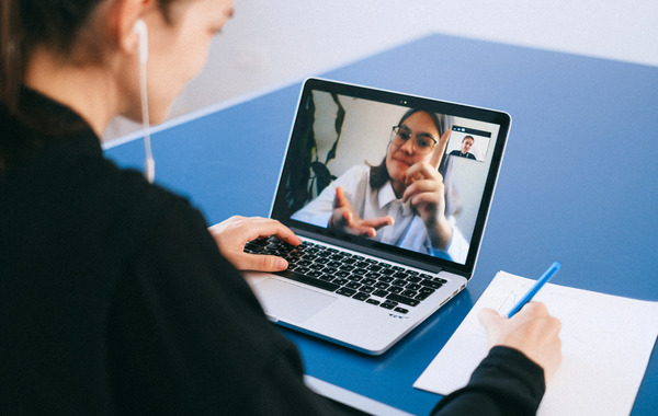 Persons talking by video conference