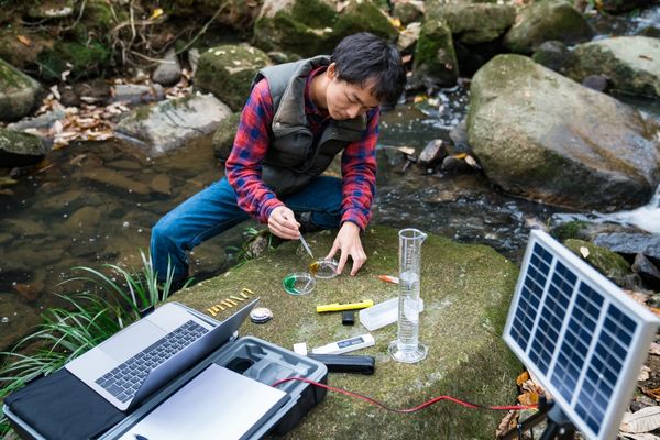 Man collecting data samples from stream